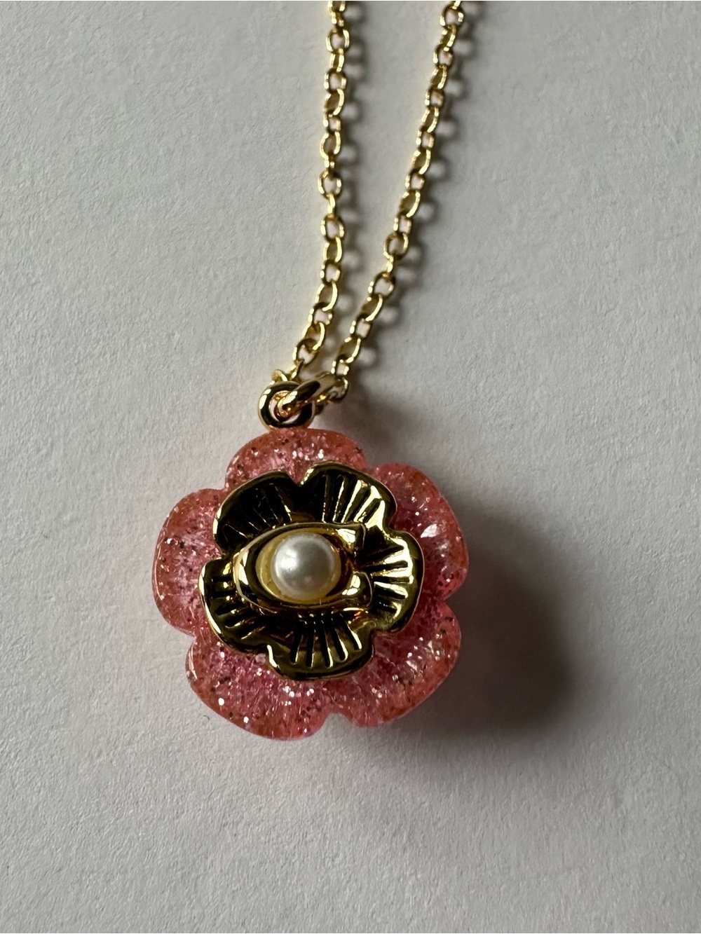 Coach Pink Glitter Flower Pendant Necklace - Gold Tone